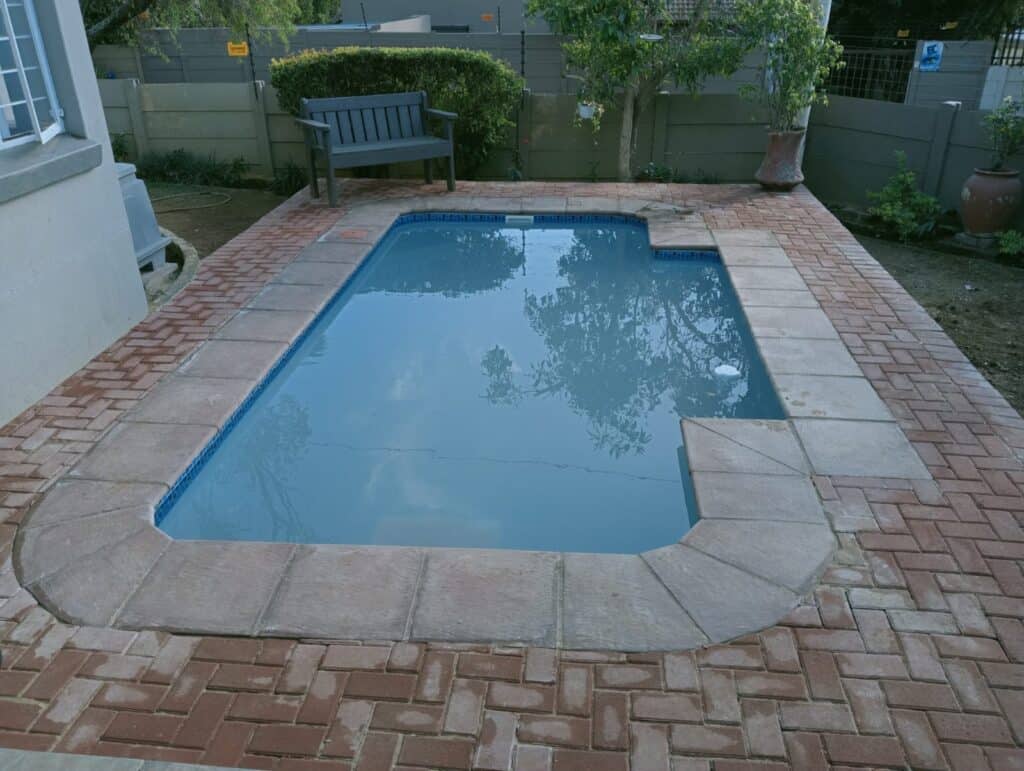 Installed Cosmo pool with brick paving